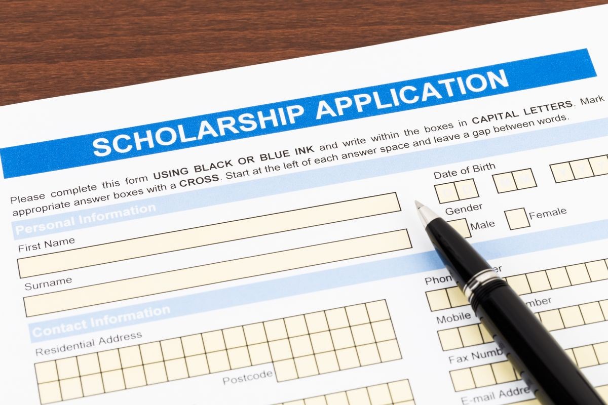 Scholarship application form with pen